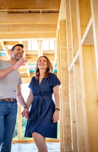Couple visiting a house under construction.